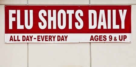 Flu shots sign posted outside.の写真素材