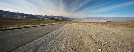 Long road in Death Valley National Park, California. Death Valley is a desert valley located in Eastern California.の写真素材