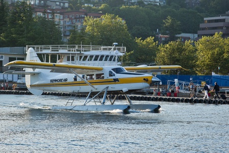 SEATTLE, WA - AUG 29: Kenmore Air1954 Dehavilland DHC-3 aircraft taxi at Lake Union Terminal, on...