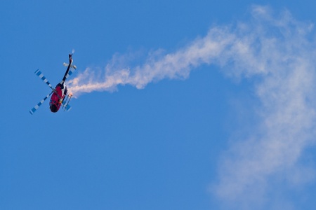 SALINAS, CA - SEPT 25: Pilot Chuck Aaron demonstrates precision of flying and the highest level of pilot skills on Red Bull aerobatic helicopter during the California International Airshow, on September 25, 2011, Salinas, CA.のeditorial素材