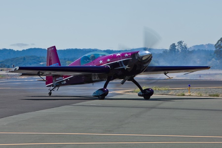 SANTA ROSA, CA - AUG 20: Vicky Benzing taxi in her purple Extra 300S after demonstration of high...