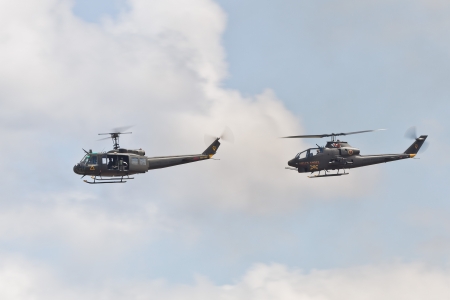 TACOMA, WA - JULY 21: Bell UH-1 Iroquois (unofficially Huey) and Bell AH-1 Cobra Helicopter Demonstration during Air Expo at McChord Field Joint Base Lewis-McChord on July 21, 2012 in Tacoma, WA. のeditorial素材