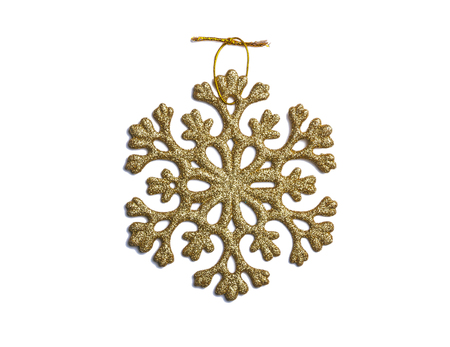 Golden Christmas snowflake isolated on white backgroundの写真素材