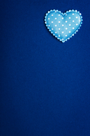 Horizontal blue background image with a heart insideの写真素材