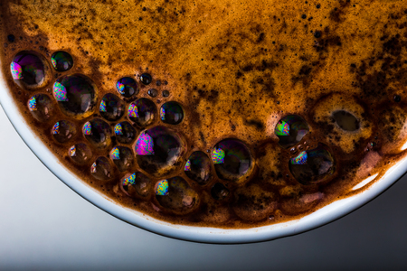 Close up view of a bubbles in a white coffee mugの写真素材