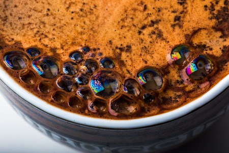 Close up view of a bubbles in a white coffee mugの写真素材