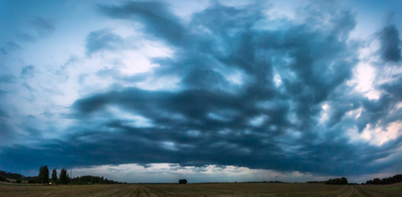 Image of dark Storm clouds in the fieldの写真素材