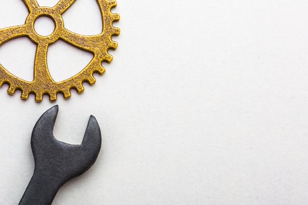 Top closeup view of gear wheel on white background with blank space for text. Top view, flat lay.