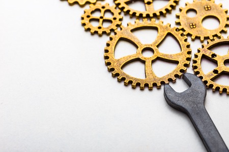 Top closeup view of gear wheel on white background with blank space for text. Top view, flat lay.