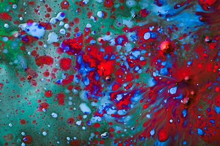 Colorful and creative abstract background of dye on glassの写真素材