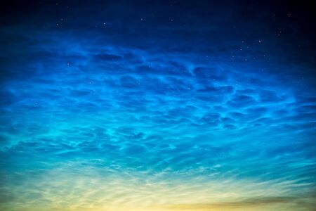 Landscape of night shining noctilucent clouds in the night sky