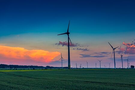 Four Wind turbines in the evening lightの写真素材