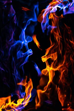 Red and blue fire on balck backgroundの写真素材