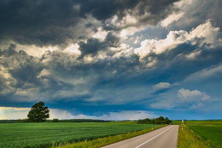 Supercell storm clouds with wall cloud and intense rainの写真素材