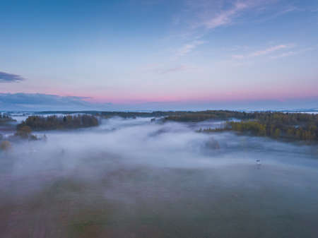 Fog and mist covering the fields in Lithuaniaの写真素材