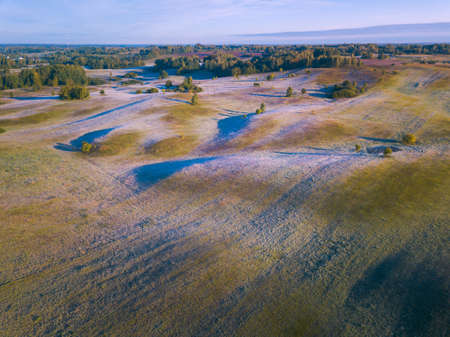 Landscape with frost shadows in the early autumn morningの写真素材