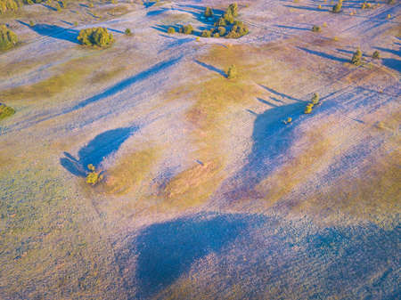 Landscape with frost shadows in the early autumn morningの写真素材