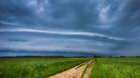 Supercell storm clouds with intense tropic rain and lightningの写真素材