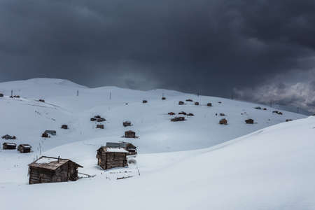 Bakhmaro in winter, Guria, Georgia. White nature of resort Bakhmaro in country Georgia. Snowy colorful wood housesの写真素材
