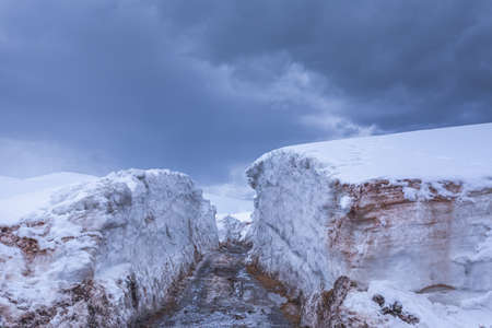 Mountain winter road with meters of snow, Bakhmaro in winter, Guria, Georgia.の写真素材