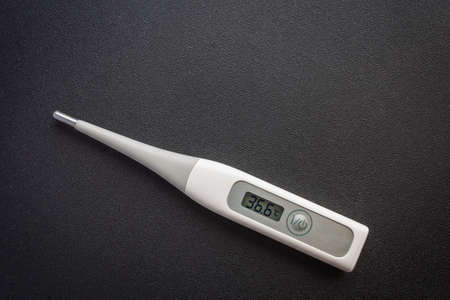 Picture of a thermometer on a dark background
