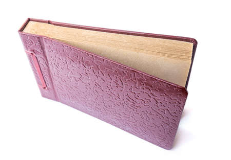 Vintage brown leather textured photo album isolated on white backgroundの写真素材