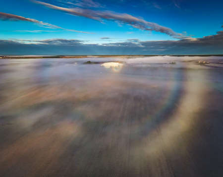 Fogbow over the fields, aerial picture of rare optic phenomenaの写真素材