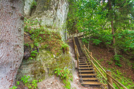 Sandstone cliffs of Sietiniezis on the shore of the river Gauja in Latviaの写真素材