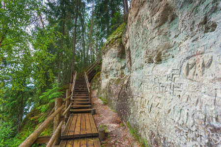 Sandstone cliffs of Sietiniezis on the shore of the river Gauja in Latviaの写真素材