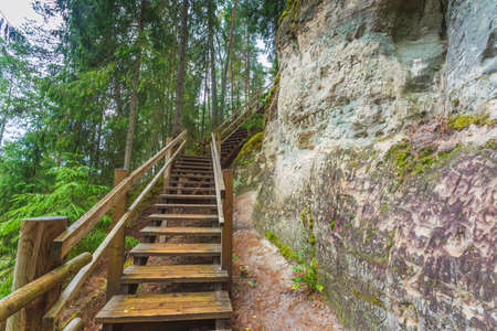 Sandstone cliffs of Sietiniezis on the shore of the river Gauja in Latviaの写真素材
