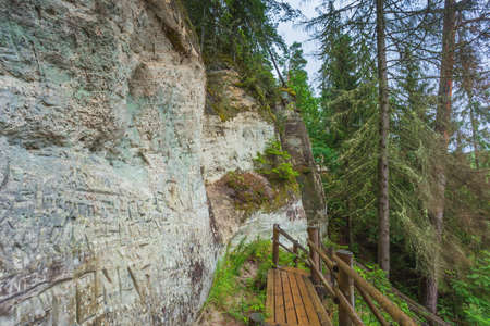 Sandstone cliffs of Sietiniezis on the shore of the river Gauja in Latviaの写真素材