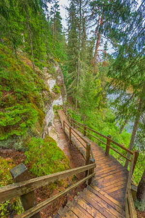 Sandstone cliffs of Sietiniezis on the shore of the river Gauja in Latviaの写真素材