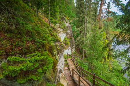 Sandstone cliffs of Sietiniezis on the shore of the river Gauja in Latviaの写真素材