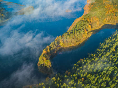 Aerial panoramic view of Asalnai lake with fog at Autumn, Lithuaniaの写真素材