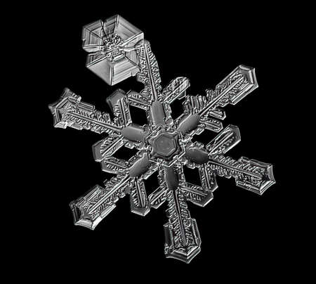 White snowflake isolated on black background. Illustration based on macro photo of real snow crystal: elegant star plate with short, broad arms, glossy relief surface and complex inner details.の写真素材