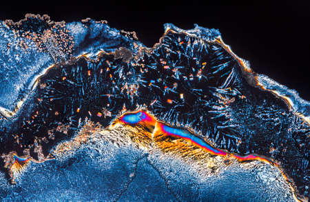 Extreme macro photograph of Vitamin C crystals forming abstract modern art patterns, when...