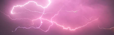 Lightning with with beautiful purple light, thunderstorm at summerの写真素材