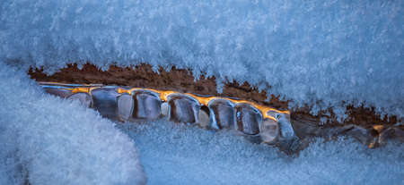 Icicles over the water in the river. Natural landscape. Winter. Background image.の写真素材