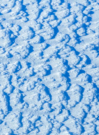 Texture of the snow, white blue pattern of the snow, cold day, natural winter pattern after...