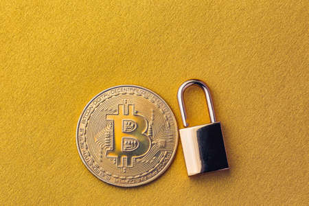 Unlock bitcoin, background with bitcoin and lockの写真素材