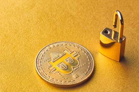 Unlock bitcoin, background with bitcoin and lockの写真素材