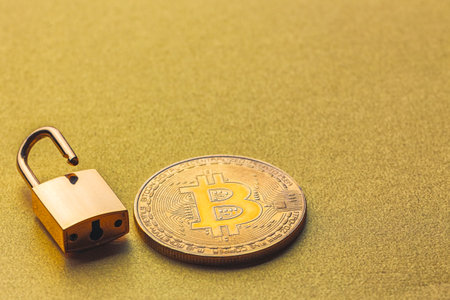 Unlock bitcoin, background with bitcoin and lockの写真素材