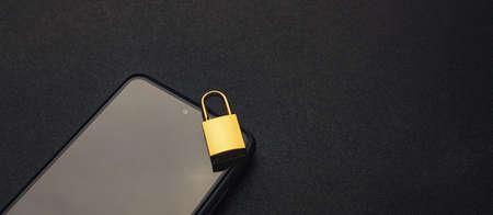Banned from using smartphone, locked phone conceptの写真素材