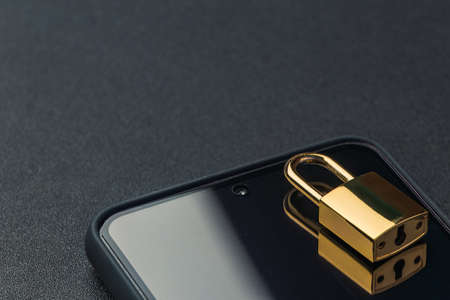 Banned from using smartphone, locked phone conceptの写真素材