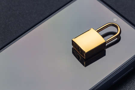 Banned from using smartphone, locked phone conceptの写真素材
