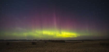 Night sky aesthetics, night sky stars with Aurora borealis in the background, beautiful night view at a roadtripの写真素材
