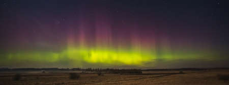 Night sky aesthetics, night sky stars with Aurora borealis in the background, beautiful night view at a roadtripの写真素材