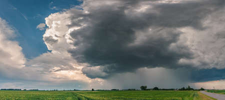 Green thunder storm clouds across the fields, summer, Lithuaniaの写真素材
