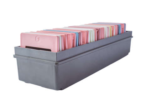 Old slides in a cardboard box on a white backgroundの写真素材