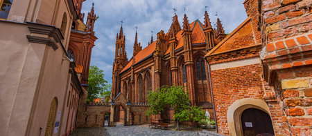 Vilnius, Lithuania. Roman Catholic Church Of St. Anne And Church Of St. Francis And St. Bernard In Old Town In Summer Sunny Day.の写真素材